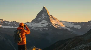 A person looking through binoculars at a distant mountain.